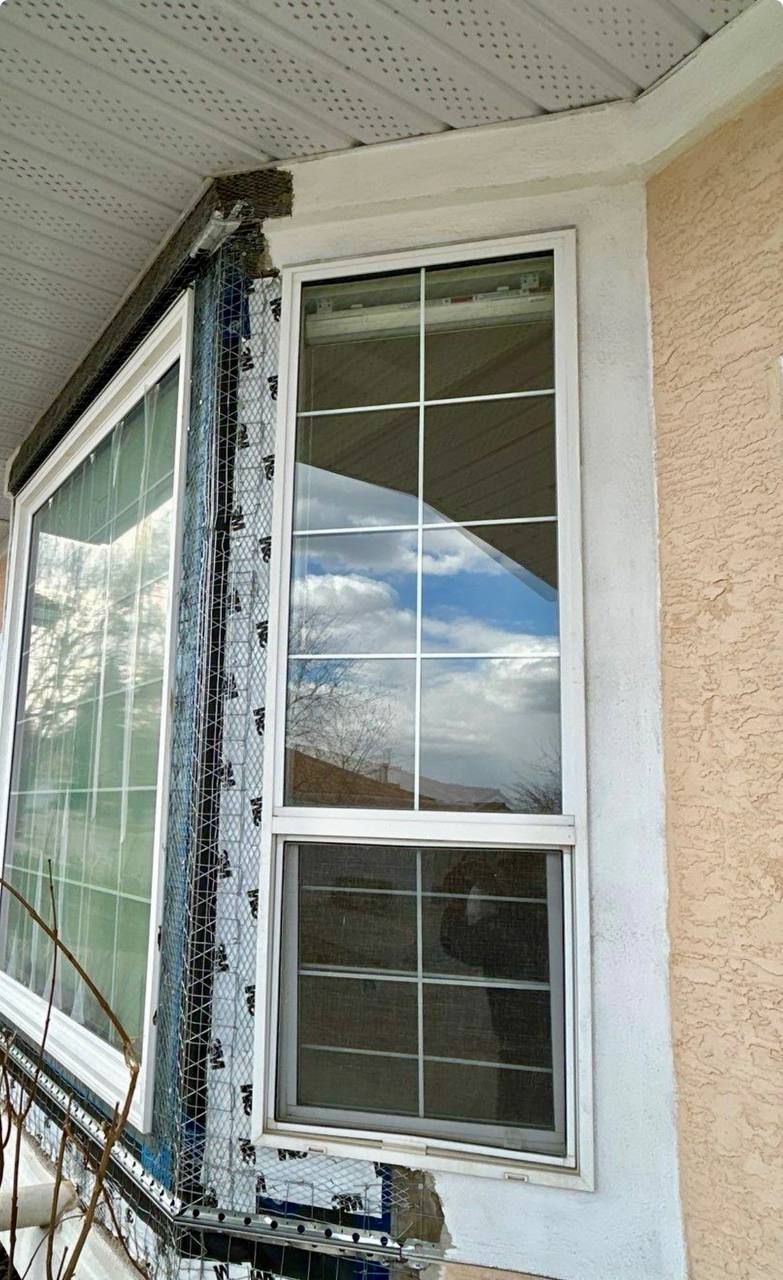 Calgary stucco home exterior winter freeze thaw damage window