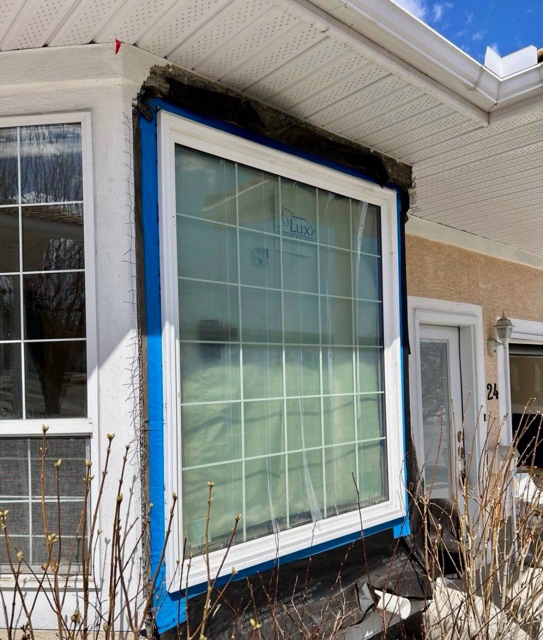 Energy efficient window installation stucco home Calgary insulation
