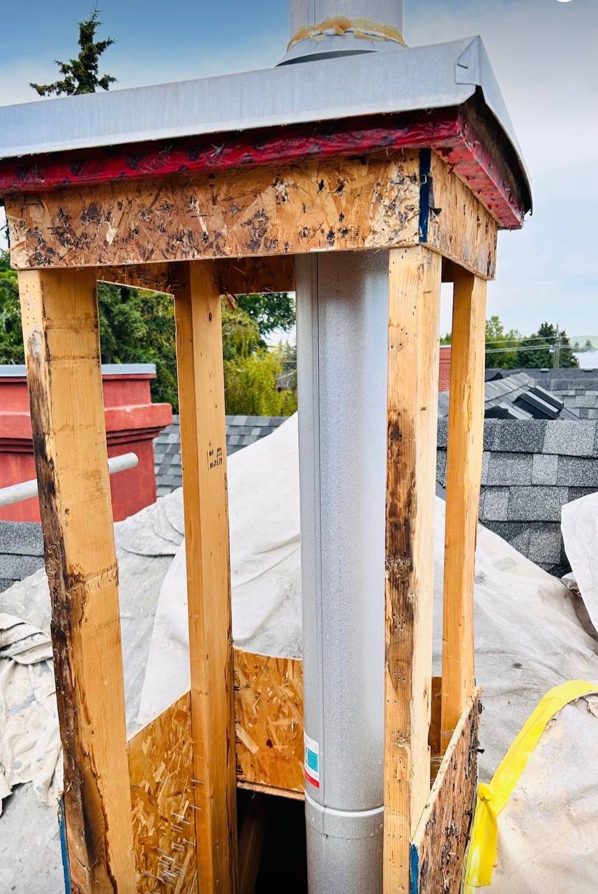 Chimney detail rebuild in progress before new stucco is applied
